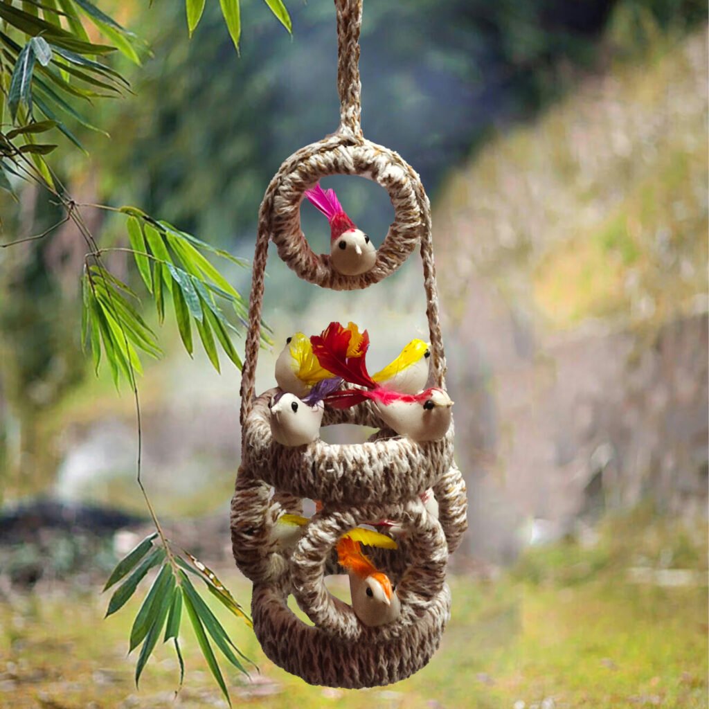 Handmade jute hanging bird nest decor with artificial birds, eggs, pom pom, feather and green plants for home balcony and living room decoration.